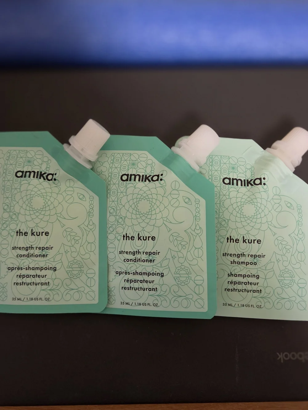 amika The Kure Strength Repair Shampoo & 2-conditioners Travel Set